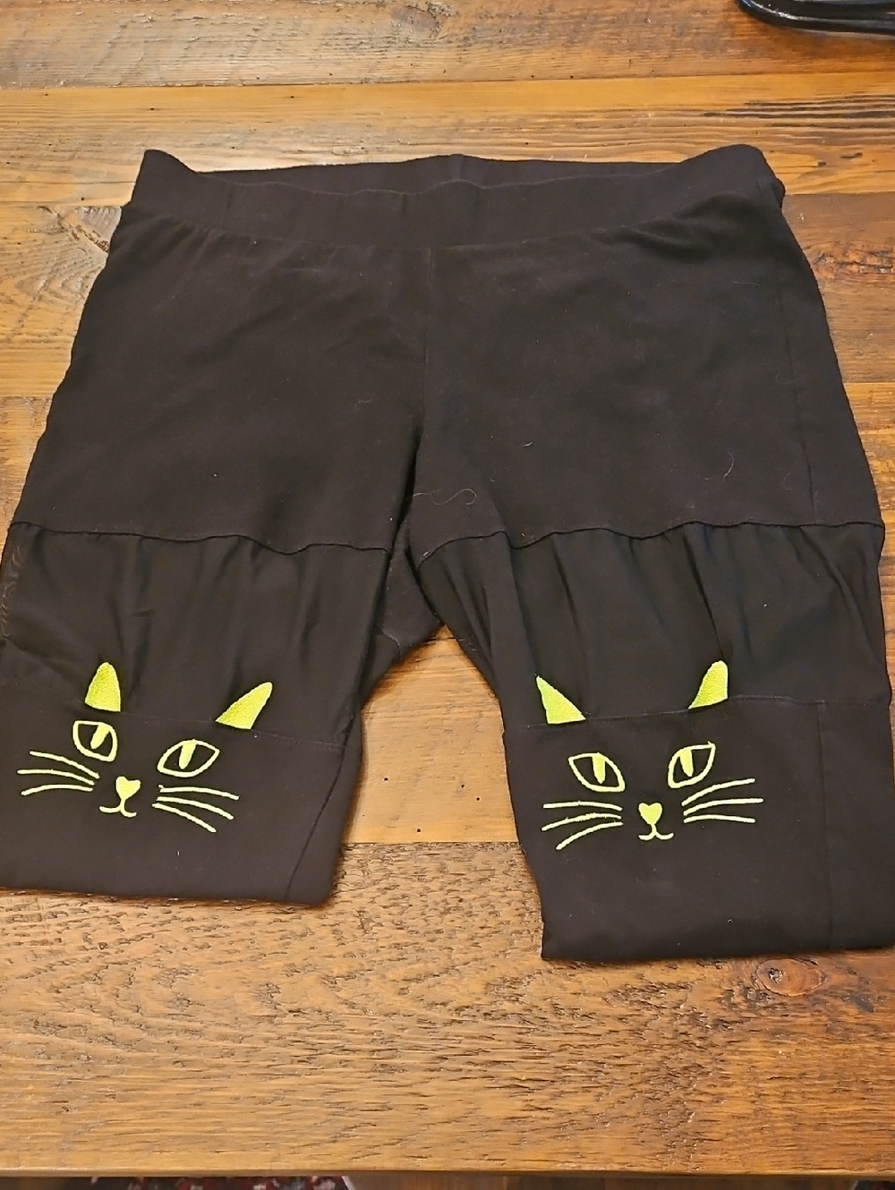 Torrid Womens Black Leggings with Neon Green/ Yellow  Cat Face Detail